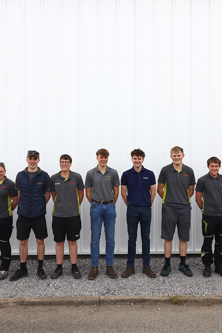 pupil stage Apprentices stand in a row next to each other